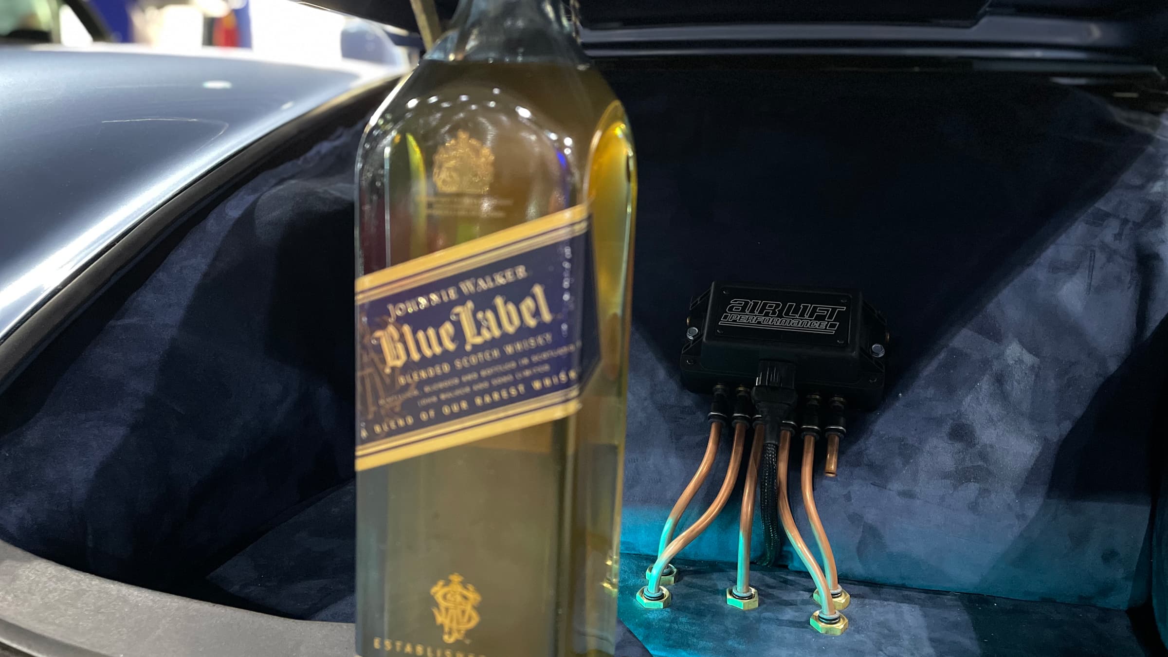 Car Show Photography Tips: Tricks For Taking Awesome Pictures At Car Shows 4 Car Photo Of Porsche 911 With Jonnie Walker Bottle Prop